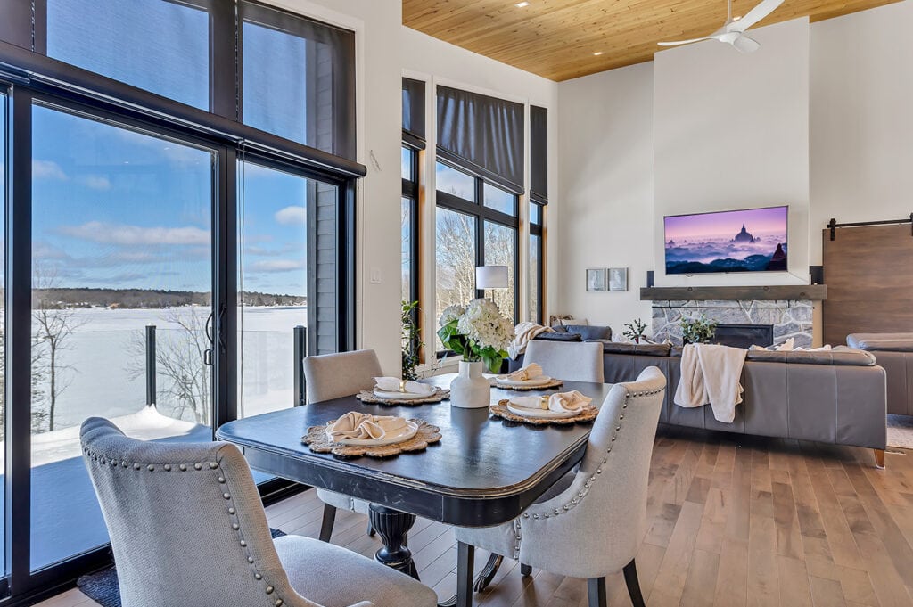dining/living area combo with large windows